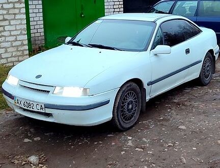 Білий Опель Калібра, об'ємом двигуна 2 л та пробігом 300 тис. км за 1400 $, фото 1 на Automoto.ua