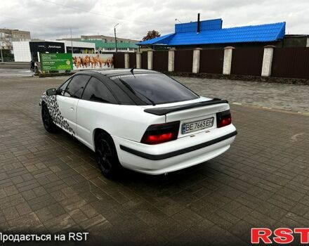 Белый Опель Калибра, объемом двигателя 2 л и пробегом 214 тыс. км за 2350 $, фото 1 на Automoto.ua