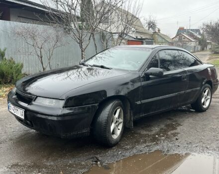 Черный Опель Калибра, объемом двигателя 2 л и пробегом 275 тыс. км за 2800 $, фото 2 на Automoto.ua