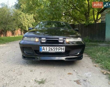 Черный Опель Калибра, объемом двигателя 2 л и пробегом 245 тыс. км за 2900 $, фото 2 на Automoto.ua