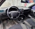 Черный Опель Калибра, объемом двигателя 2 л и пробегом 500 тыс. км за 1400 $, фото 1 на Automoto.ua