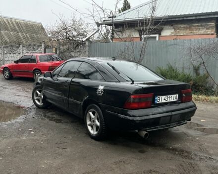 Черный Опель Калибра, объемом двигателя 2 л и пробегом 275 тыс. км за 2800 $, фото 1 на Automoto.ua