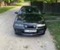 Черный Опель Калибра, объемом двигателя 2 л и пробегом 245 тыс. км за 2300 $, фото 1 на Automoto.ua