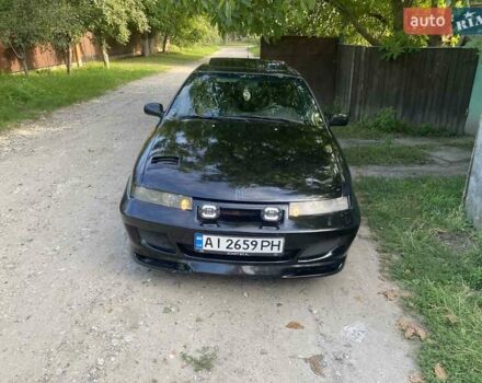Черный Опель Калибра, объемом двигателя 2 л и пробегом 245 тыс. км за 2900 $, фото 1 на Automoto.ua