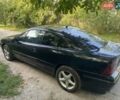 Черный Опель Калибра, объемом двигателя 2 л и пробегом 245 тыс. км за 2900 $, фото 7 на Automoto.ua