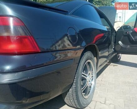 Черный Опель Калибра, объемом двигателя 2 л и пробегом 256 тыс. км за 3000 $, фото 13 на Automoto.ua