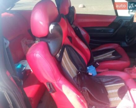 Черный Опель Калибра, объемом двигателя 2 л и пробегом 256 тыс. км за 3000 $, фото 9 на Automoto.ua