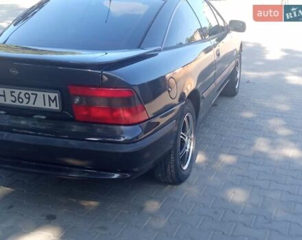 Черный Опель Калибра, объемом двигателя 2 л и пробегом 256 тыс. км за 3000 $, фото 25 на Automoto.ua