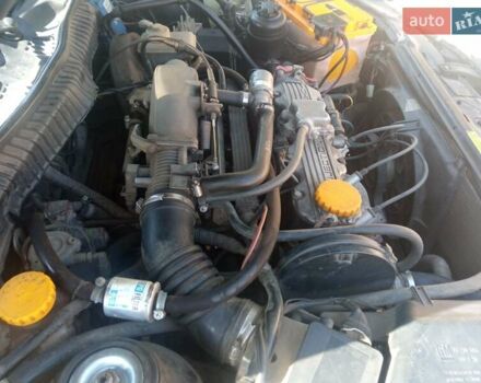 Черный Опель Калибра, объемом двигателя 2 л и пробегом 256 тыс. км за 3000 $, фото 17 на Automoto.ua