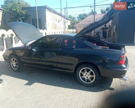 Черный Опель Калибра, объемом двигателя 2 л и пробегом 256 тыс. км за 3000 $, фото 7 на Automoto.ua