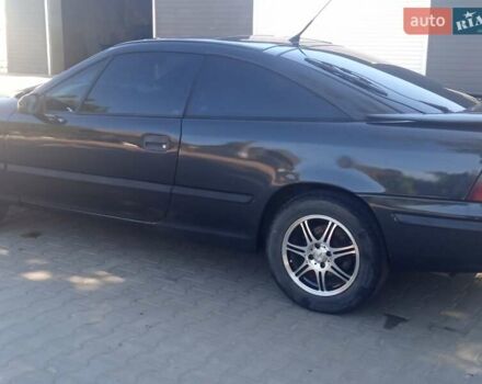 Черный Опель Калибра, объемом двигателя 2 л и пробегом 256 тыс. км за 3000 $, фото 34 на Automoto.ua