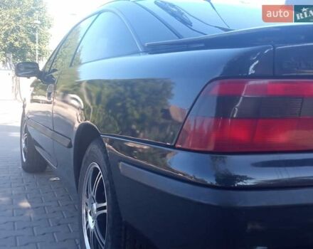 Черный Опель Калибра, объемом двигателя 2 л и пробегом 256 тыс. км за 3000 $, фото 32 на Automoto.ua