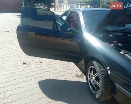 Черный Опель Калибра, объемом двигателя 2 л и пробегом 256 тыс. км за 3000 $, фото 15 на Automoto.ua