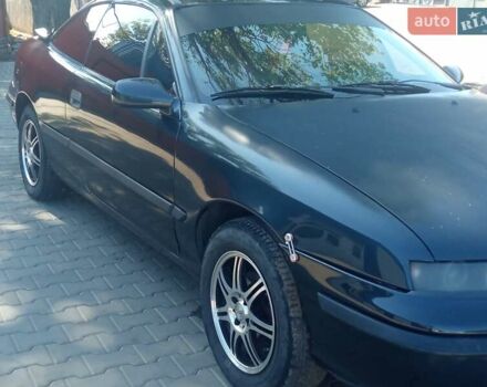 Черный Опель Калибра, объемом двигателя 2 л и пробегом 256 тыс. км за 3000 $, фото 26 на Automoto.ua