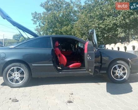 Черный Опель Калибра, объемом двигателя 2 л и пробегом 256 тыс. км за 3000 $, фото 21 на Automoto.ua