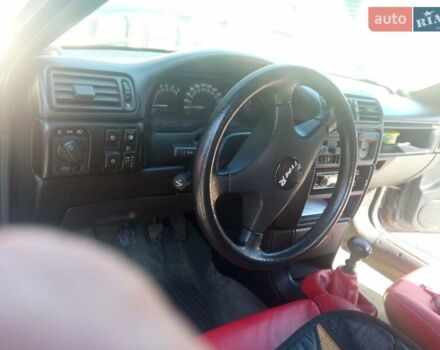 Черный Опель Калибра, объемом двигателя 2 л и пробегом 256 тыс. км за 3000 $, фото 19 на Automoto.ua