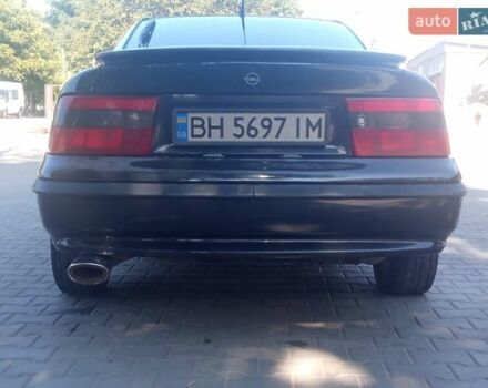 Черный Опель Калибра, объемом двигателя 2 л и пробегом 256 тыс. км за 3000 $, фото 24 на Automoto.ua
