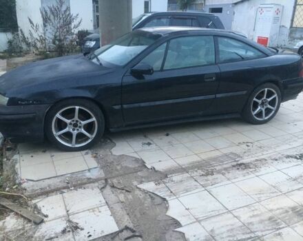 Черный Опель Калибра, объемом двигателя 2 л и пробегом 300 тыс. км за 1700 $, фото 2 на Automoto.ua