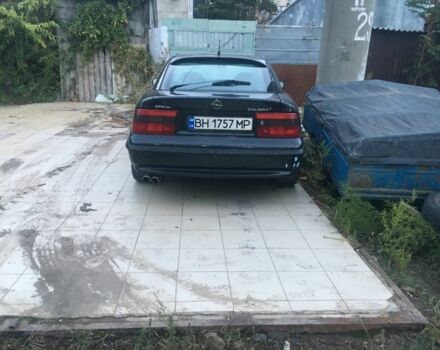 Черный Опель Калибра, объемом двигателя 2 л и пробегом 300 тыс. км за 1700 $, фото 1 на Automoto.ua