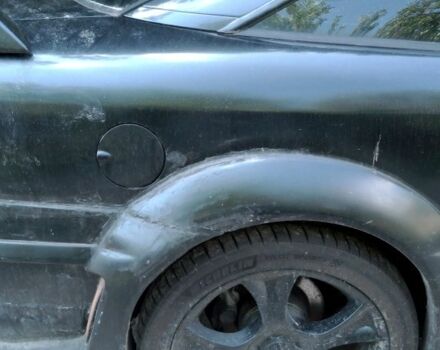 Чорний Опель Калібра, об'ємом двигуна 2 л та пробігом 520 тис. км за 2047 $, фото 11 на Automoto.ua