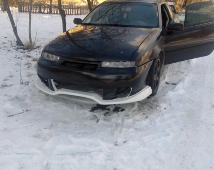 Чорний Опель Калібра, об'ємом двигуна 2 л та пробігом 520 тис. км за 2047 $, фото 3 на Automoto.ua