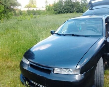 Черный Опель Калибра, объемом двигателя 2 л и пробегом 520 тыс. км за 2059 $, фото 1 на Automoto.ua