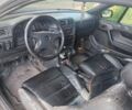 Чорний Опель Калібра, об'ємом двигуна 2 л та пробігом 320 тис. км за 2500 $, фото 2 на Automoto.ua