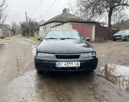 Черный Опель Калибра, объемом двигателя 2 л и пробегом 275 тыс. км за 2800 $, фото 1 на Automoto.ua