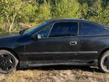 Чорний Опель Калібра, об'ємом двигуна 2 л та пробігом 400 тис. км за 1649 $, фото 1 на Automoto.ua