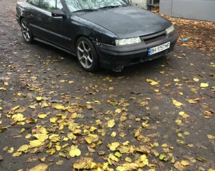 Черный Опель Калибра, объемом двигателя 2 л и пробегом 300 тыс. км за 1700 $, фото 1 на Automoto.ua