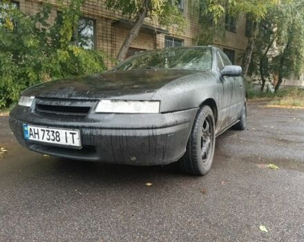 Черный Опель Калибра, объемом двигателя 2 л и пробегом 330 тыс. км за 3000 $, фото 1 на Automoto.ua