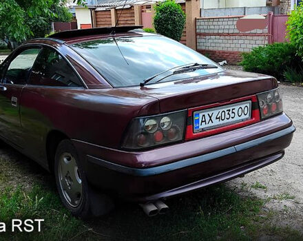 Красный Опель Калибра, объемом двигателя 2 л и пробегом 350 тыс. км за 2000 $, фото 3 на Automoto.ua