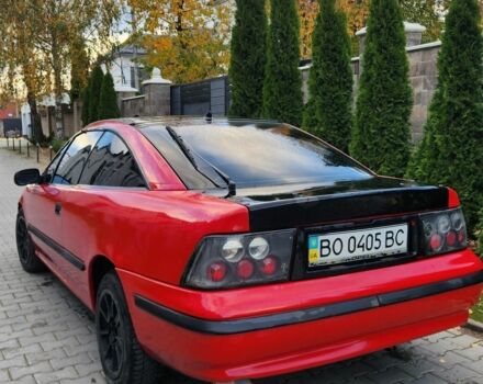 Червоний Опель Калібра, об'ємом двигуна 2 л та пробігом 200 тис. км за 1850 $, фото 2 на Automoto.ua