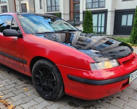 Червоний Опель Калібра, об'ємом двигуна 2 л та пробігом 200 тис. км за 1850 $, фото 3 на Automoto.ua