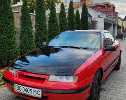 Червоний Опель Калібра, об'ємом двигуна 2 л та пробігом 200 тис. км за 1850 $, фото 1 на Automoto.ua