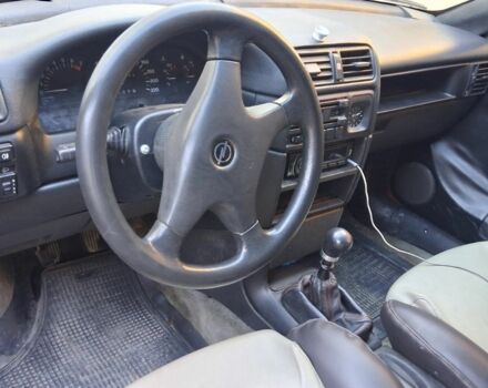 Червоний Опель Калібра, об'ємом двигуна 2 л та пробігом 200 тис. км за 1850 $, фото 5 на Automoto.ua