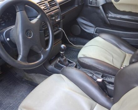 Червоний Опель Калібра, об'ємом двигуна 2 л та пробігом 200 тис. км за 1850 $, фото 6 на Automoto.ua