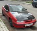 Красный Опель Калибра, объемом двигателя 2 л и пробегом 300 тыс. км за 2400 $, фото 1 на Automoto.ua