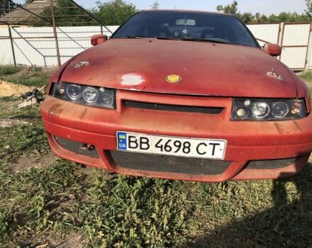 Червоний Опель Калібра, об'ємом двигуна 2 л та пробігом 300 тис. км за 1850 $, фото 6 на Automoto.ua