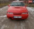 Красный Опель Калибра, объемом двигателя 2 л и пробегом 330 тыс. км за 1499 $, фото 1 на Automoto.ua