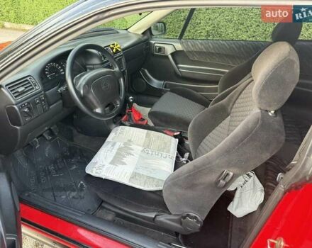 Червоний Опель Калібра, об'ємом двигуна 2 л та пробігом 180 тис. км за 5500 $, фото 6 на Automoto.ua