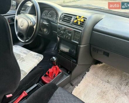 Червоний Опель Калібра, об'ємом двигуна 2 л та пробігом 180 тис. км за 5500 $, фото 5 на Automoto.ua