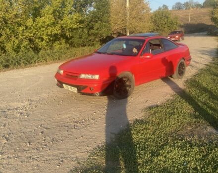 Красный Опель Калибра, объемом двигателя 2 л и пробегом 270 тыс. км за 1700 $, фото 5 на Automoto.ua