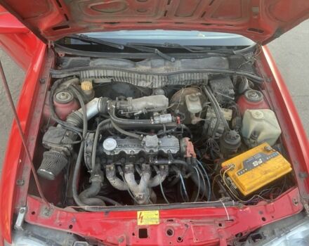 Красный Опель Калибра, объемом двигателя 2 л и пробегом 270 тыс. км за 1700 $, фото 7 на Automoto.ua