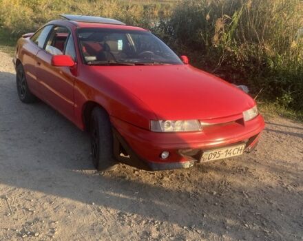 Красный Опель Калибра, объемом двигателя 2 л и пробегом 270 тыс. км за 1700 $, фото 3 на Automoto.ua