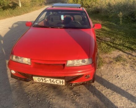 Красный Опель Калибра, объемом двигателя 2 л и пробегом 270 тыс. км за 1700 $, фото 4 на Automoto.ua