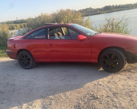 Красный Опель Калибра, объемом двигателя 2 л и пробегом 270 тыс. км за 1700 $, фото 2 на Automoto.ua