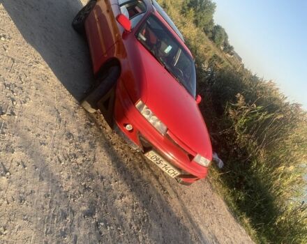 Красный Опель Калибра, объемом двигателя 2 л и пробегом 270 тыс. км за 1700 $, фото 1 на Automoto.ua