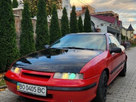 Красный Опель Калибра, объемом двигателя 2 л и пробегом 200 тыс. км за 1850 $, фото 1 на Automoto.ua