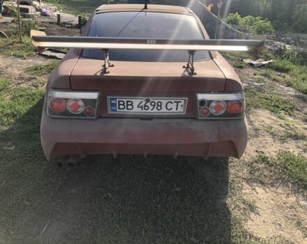 Червоний Опель Калібра, об'ємом двигуна 2 л та пробігом 300 тис. км за 1850 $, фото 1 на Automoto.ua